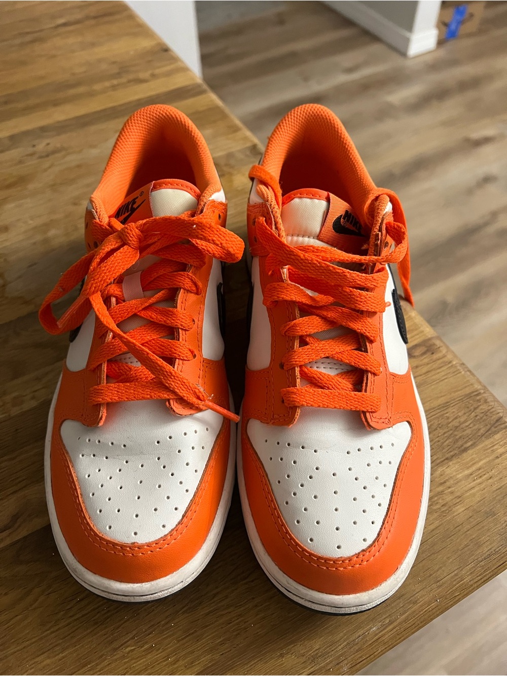 Nike Kids Low-Top Sneakers in Orange and White with Black Swoosh